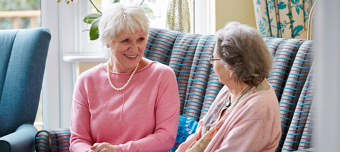 Trustee of Abbeyfield chatting to a resident