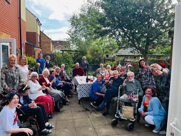 Sheltered housing scheme rejuvenates its garden for Coronation celebrations Image