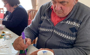 Gordon working on his paper person Image