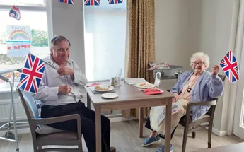 100 year old Kathy enjoying VE Day at Alexander House Image